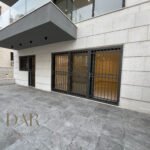 Ground-Floor Apartment with Terrace in Al Rabieh For Sale The unit features two separate entrances, adding convenience and flexibility for daily use. The apartment also includes two private parking garages, providing secure and direct access for residents. The outdoor terrace extends the living space outward and offers a pleasant setting for seating and leisure. This residence represents a solid offering within Jordan’s residential market for buyers seeking ground-floor living with functional outdoor areas and dedicated parking in a well-established neighborhood.