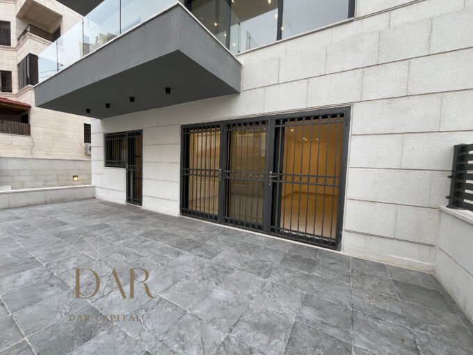 Ground-Floor Apartment with Terrace in Al Rabieh For Sale The unit features two separate entrances, adding convenience and flexibility for daily use. The apartment also includes two private parking garages, providing secure and direct access for residents. The outdoor terrace extends the living space outward and offers a pleasant setting for seating and leisure. This residence represents a solid offering within Jordan’s residential market for buyers seeking ground-floor living with functional outdoor areas and dedicated parking in a well-established neighborhood.